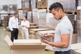 Portrait of male manager using digital tablet in warehouse-1